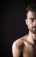 Fototapeta premium Portrait of a young man half face