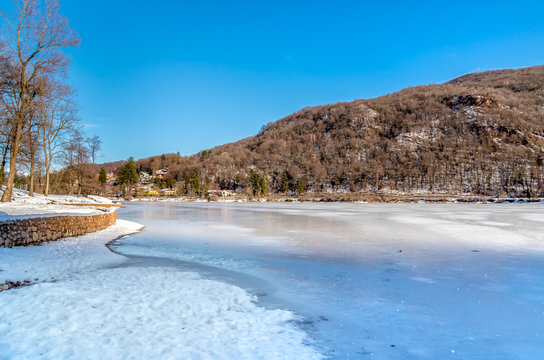 View of frozen lake Ghirla in winter, province of Varese, Italy.