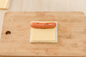 Chef making hot dog cheese toast