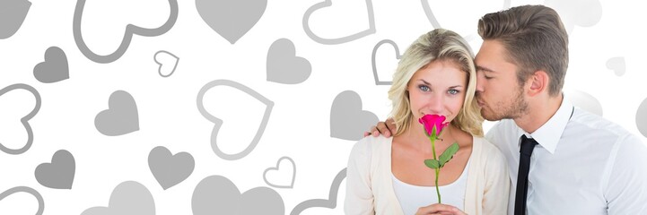 Valentines couple holding rose with love hearts background