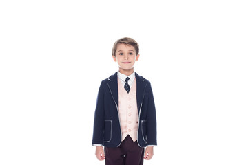 little boy standing in suit, isolated on white