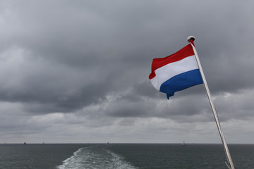 Dutch flag amongst sea and sky