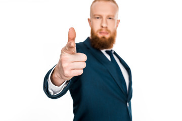 close-up view of bearded businessman pointing at camera isolated on white