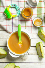 Baby food. Baby puree from fresh green apples.