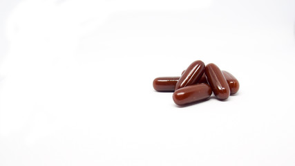 Brown pill with white background.