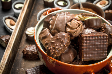 Chocolate candies in bowl. .