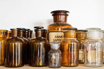 Many small glass medical bottles.