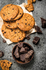 Oatmeal cookies with chocolate in a bowl.