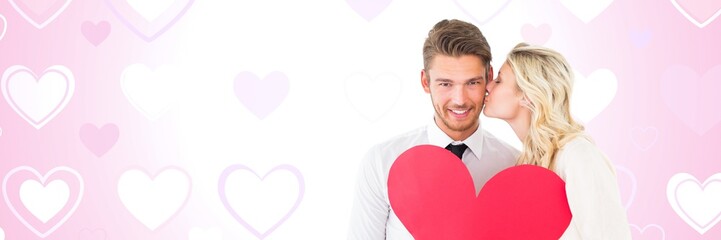 Valentines couple holding heart with love hearts background