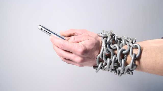  Nomophobia, chained hands with phone