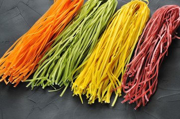 Colorful pasta on a black background
