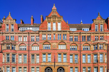 Fototapeta na wymiar Facade of an old red brick mansion in London