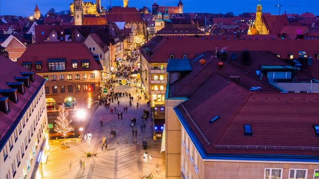 Nuremberg aerial night cityscape. Time lapse. Camera moves from the bottom up