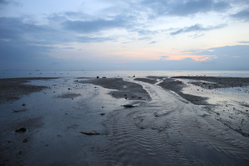 In the evening there are many sea water flows and beautiful blue sky.