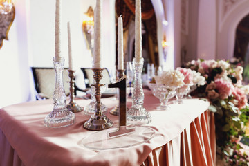 Look from afar at luxurious restaurant hall prepared for wedding dinner