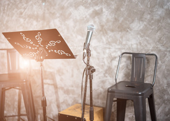 Microphone with chair on stage show