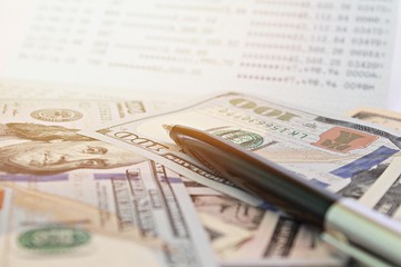 Business, finance, investment, savings or accounting concept : American Dollars cash money and...