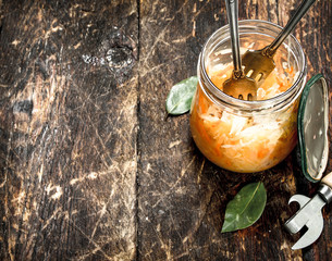 Marinated cabbage in glass jar.