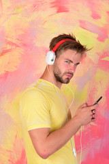 Cheerful teenage dj listening songs via earphones.