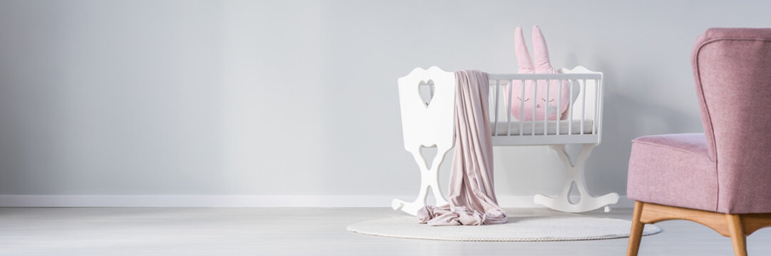 White cradle in baby's bedroom