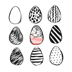 Hand drawn vector abstract Easter brush painted eggs collection set with floral motif in black and white colors isolated.Easter spring decoration background.Easter design elements.Eggs hunt concept