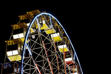 detail of a night-time panorama wheel lit by lights