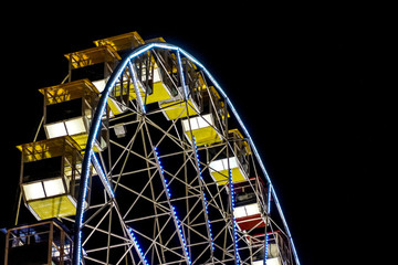 detail of a night-time panorama wheel lit by lights