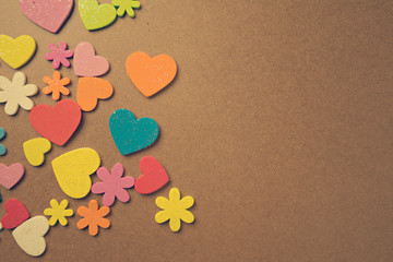 Flat lay design of colourful heart shape on wooden background for Love and valentine's day.