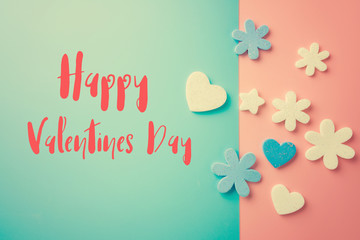 Fototapeta na wymiar Flat lay design of heart on pink and blue background. with word happy valentine's day.