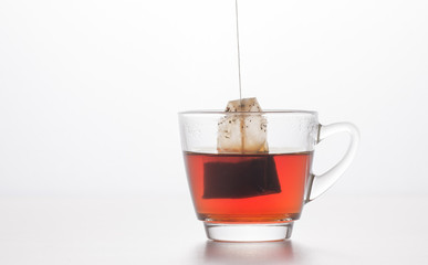 tea cup with tea bag on white background