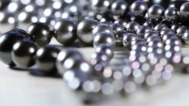 Black Pearls In White Surface Close Up Macro With Folow Focus.