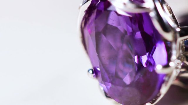 Purple gemstone on costume jewelry