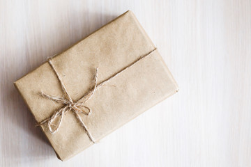 Vintage Brown gift box on wooden background - filter processing