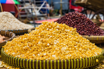 Yellow soaked peas on the tray in the market