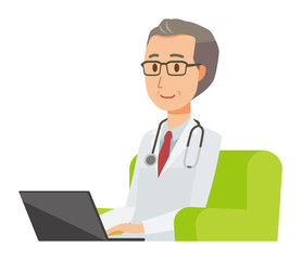 A middle-aged male doctor wearing a white suit sitting on a sofa and operating a laptop computer