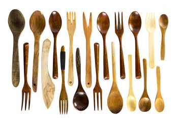 Wooden spoons and forks on white background
