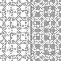 White and gray floral backgrounds. Set of seamless patterns