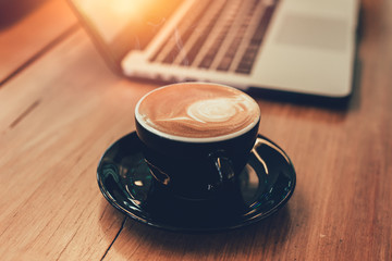 latte coffee while working with laptop computer background