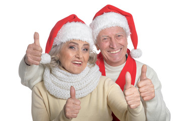 Senior couple in Santa hats