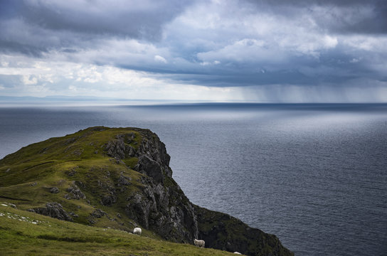 Cliff and Donegal Bay under cloudy sky, County Donegal, Ireland