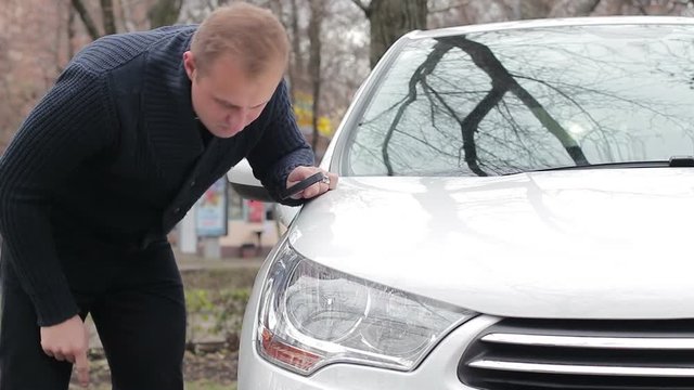 Disappointed car owner noticed scratches on the body