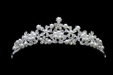 tiara with pearls isolated on a black background © vitaly tiagunov