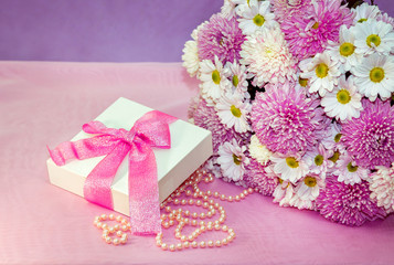 Beautiful white and pink aster and chrysanthemums bouquet -colorful fresh flowers arrangement , white present box with pink ribbon and pearl beads.