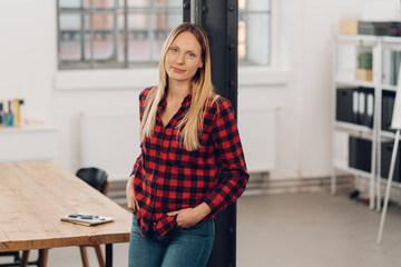 Relaxed casual businesswoman in a modern office