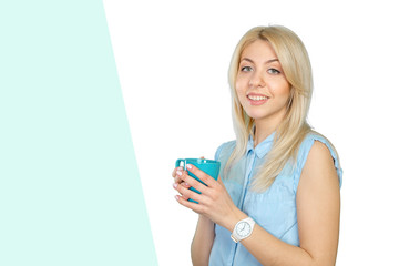 Beautiful blonde woman holding a cup of coffee