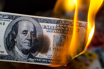 Burning one hundred dollar
