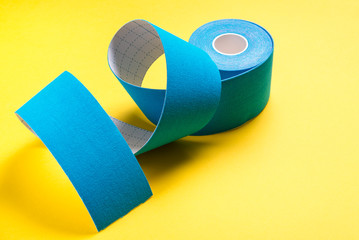 Kinesiology tape on colored background