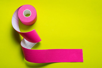 Kinesiology tape on colored background