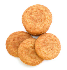 Stack of snickerdoodles over white.