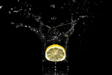 Lemon water splash in glass